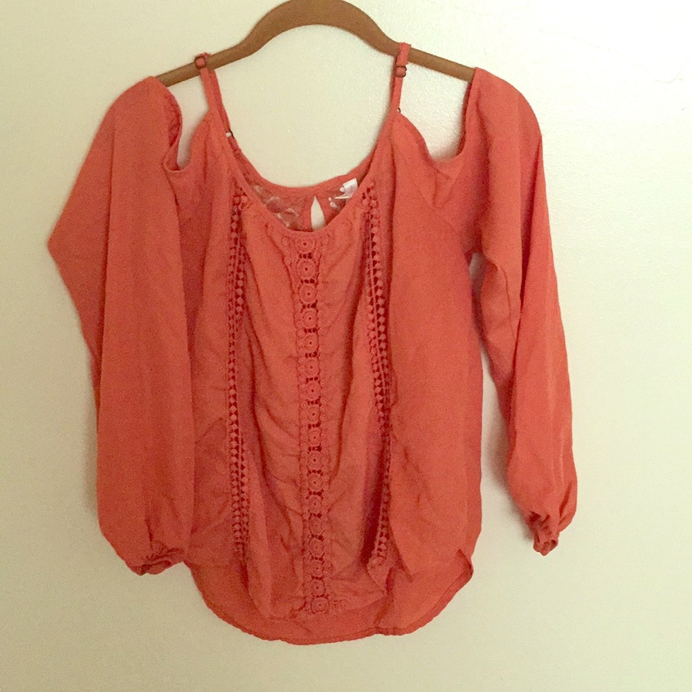 Cute orange shoulder revealing long sleeve top!